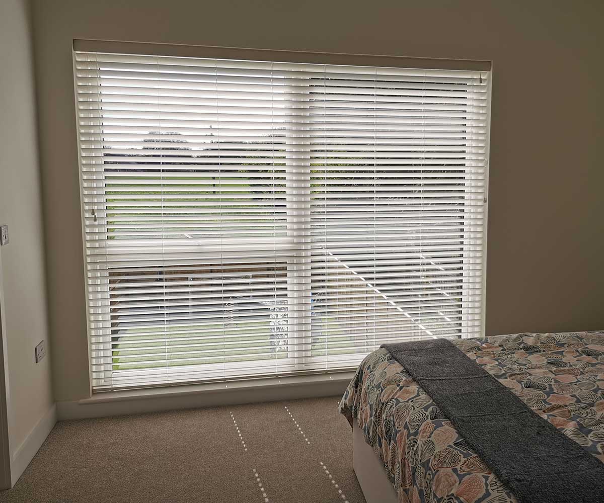 Large white fauxwood Venetian blind with 50mm slats